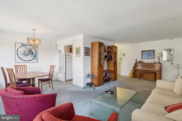 carpeted living room with a chandelier