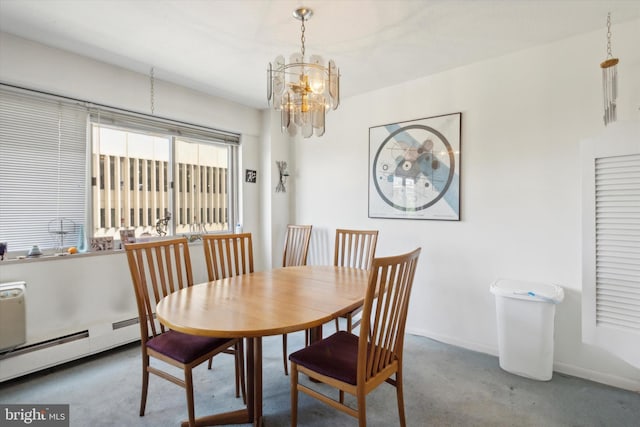 carpeted dining area featuring a baseboard heating unit and a notable chandelier