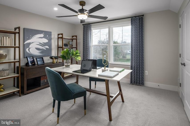 carpeted office with ceiling fan and vaulted ceiling