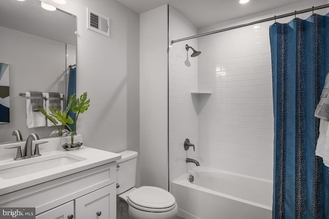 full bathroom with toilet, vanity, and shower / bathtub combination with curtain