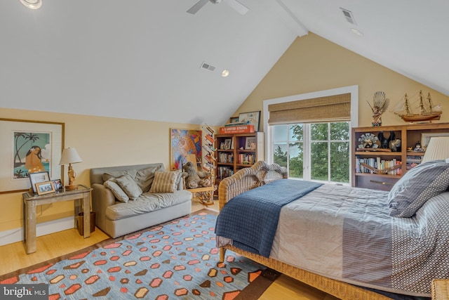 bedroom featuring lofted ceiling with beams, ceiling fan, and wood-type flooring