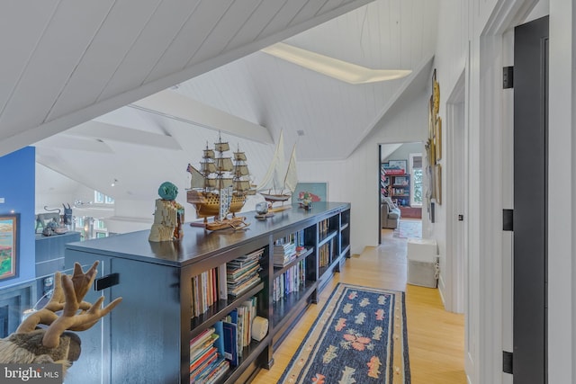 bar featuring vaulted ceiling with beams and wood-type flooring