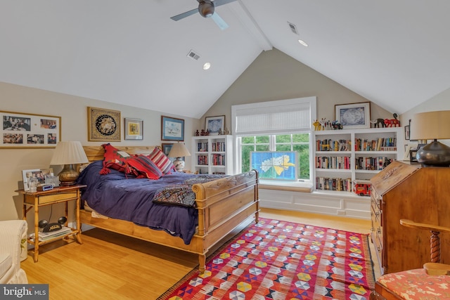 bedroom featuring lofted ceiling with beams, hardwood / wood-style flooring, and ceiling fan