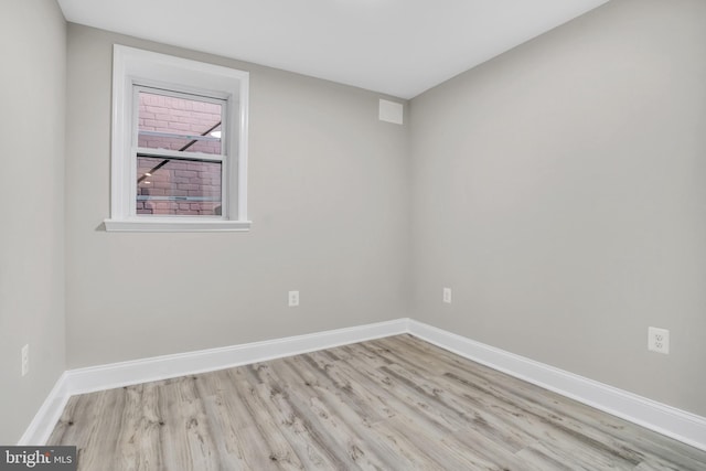 empty room with light wood-type flooring