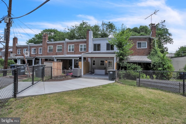 view of front of house with central AC, a front lawn, and covered porch