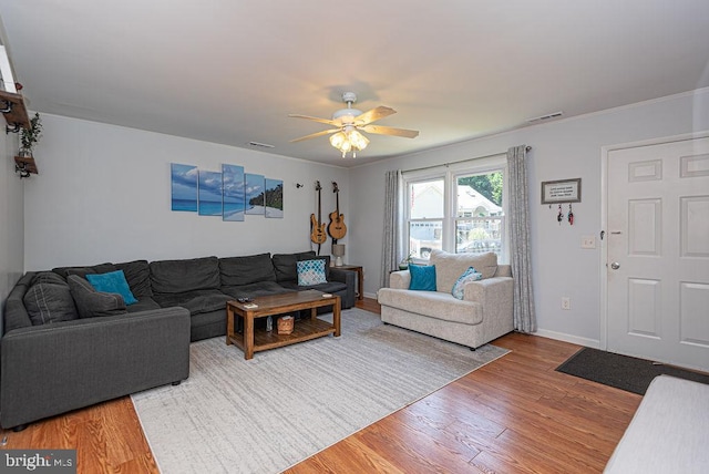 living room with ceiling fan and wood-type flooring