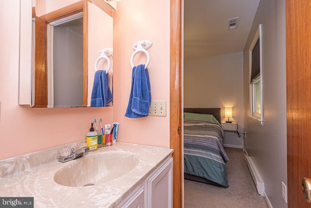 bathroom with vanity and a baseboard radiator