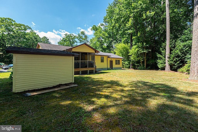 view of yard with a sunroom