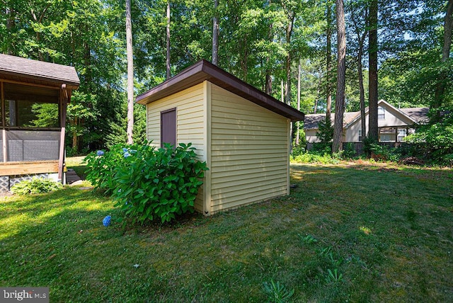 view of outdoor structure with a lawn