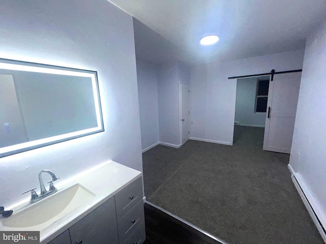 bathroom with vanity and a baseboard radiator