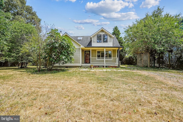 view of front of home with covered porch and a front yard