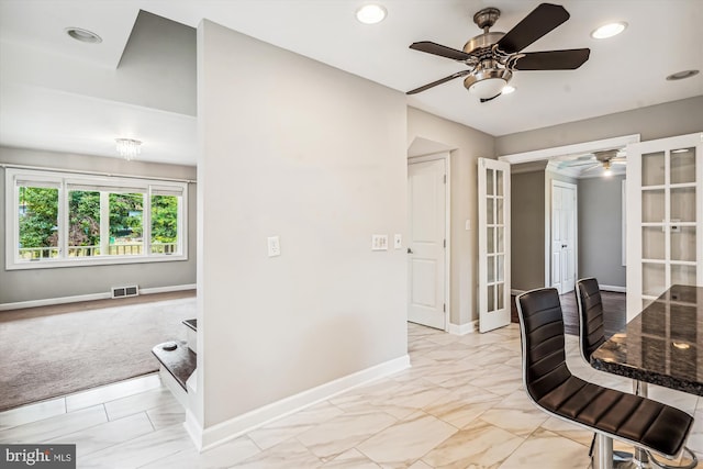 office featuring light carpet, french doors, and ceiling fan