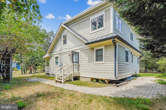 rear view of property featuring a patio