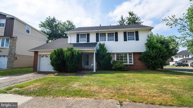 view of front of property featuring a garage and a front yard