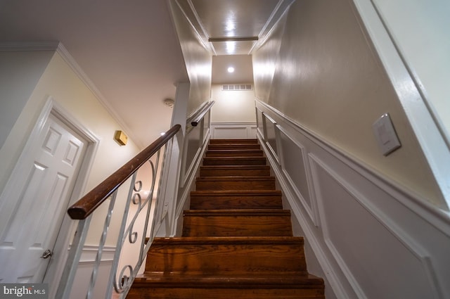 staircase with ornamental molding