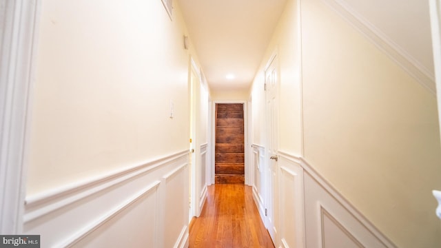 hallway with light hardwood / wood-style flooring