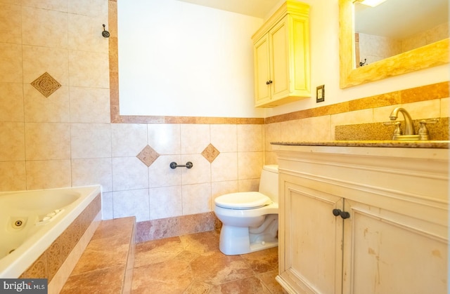 full bathroom with tile patterned flooring, toilet, shower / tub combination, vanity, and tile walls