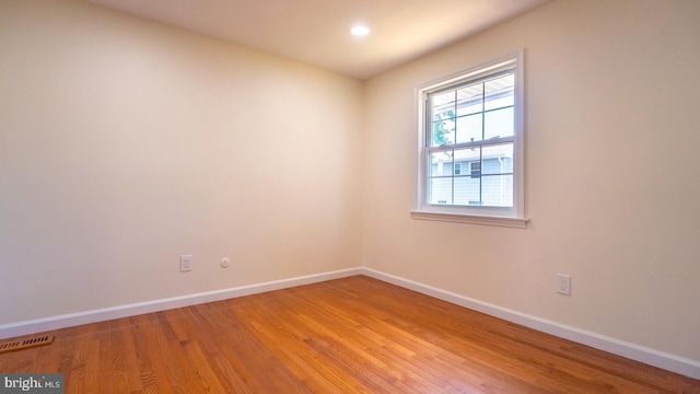 empty room featuring wood-type flooring