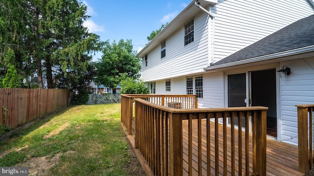 wooden terrace with a yard