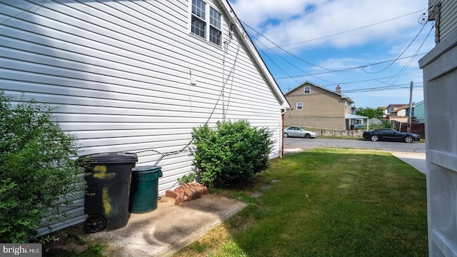 view of side of property with a yard