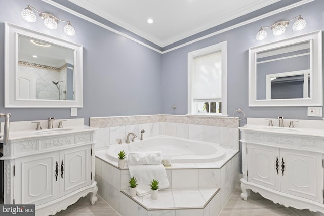 bathroom featuring vanity, a relaxing tiled tub, and ornamental molding