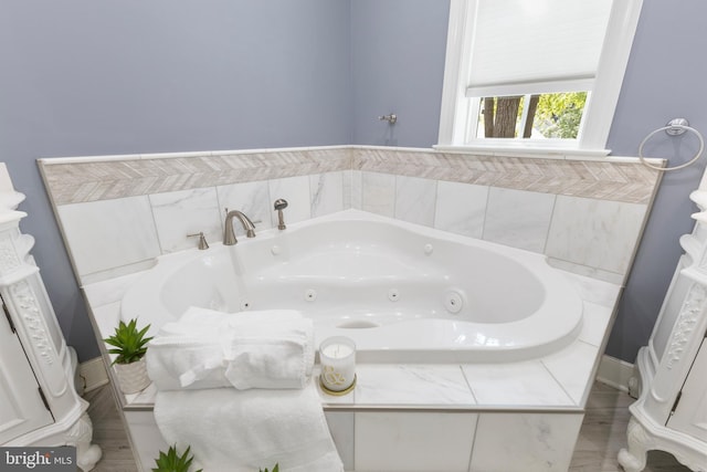 bathroom with tiled tub