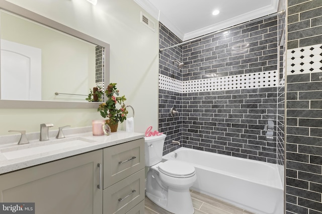 full bathroom featuring tiled shower / bath combo, ornamental molding, toilet, vanity, and hardwood / wood-style flooring