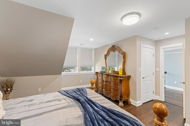 bedroom featuring dark hardwood / wood-style flooring