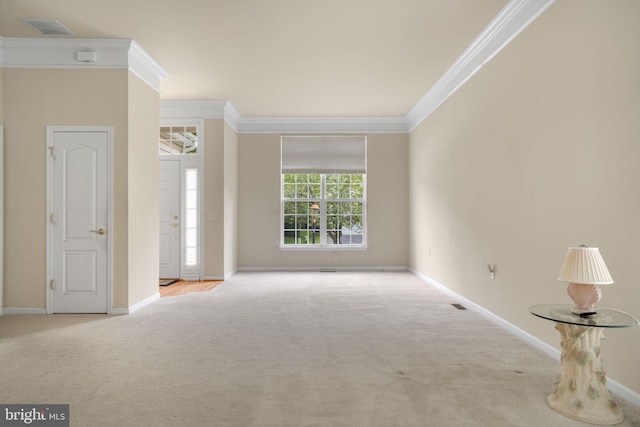 unfurnished room featuring light colored carpet, crown molding, and visible vents