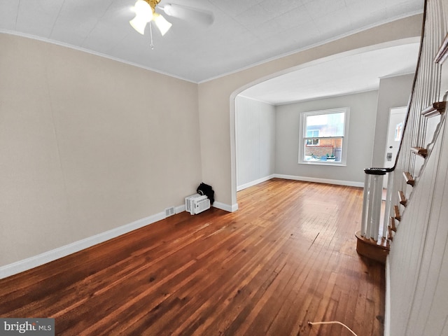 spare room featuring ceiling fan, crown molding, and hardwood / wood-style flooring