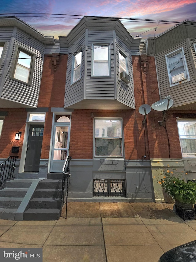 view of front of home with brick siding