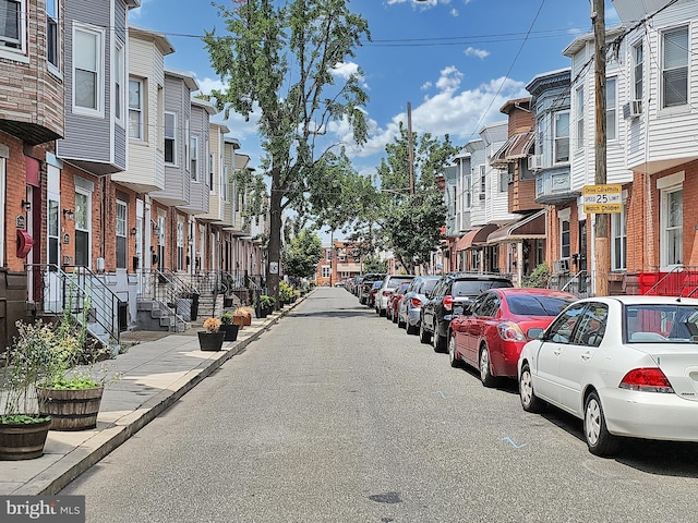 view of street with a residential view and sidewalks