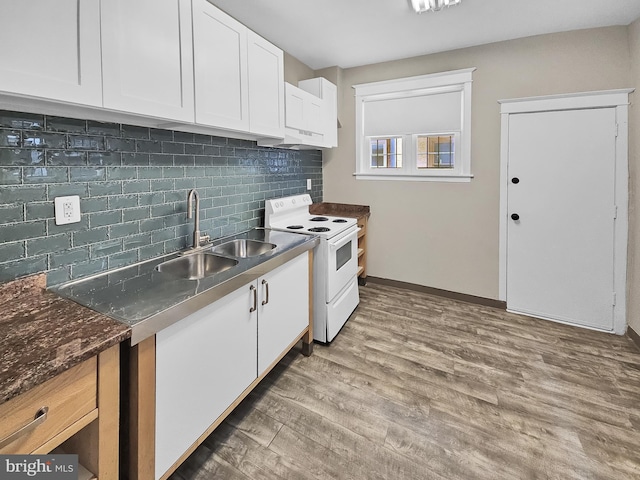 kitchen featuring decorative backsplash, wood finished floors, electric range, white cabinetry, and a sink