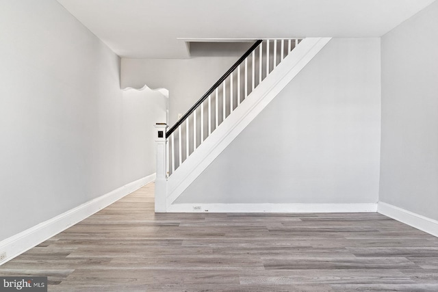 stairs featuring wood-type flooring