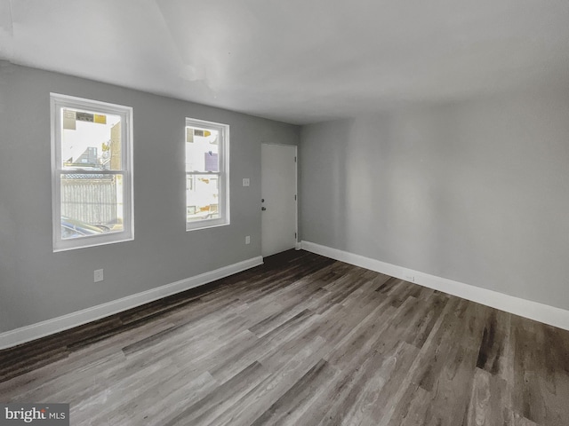 empty room with wood-type flooring