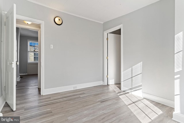 spare room featuring light hardwood / wood-style flooring