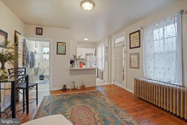 interior space featuring hardwood / wood-style flooring and radiator