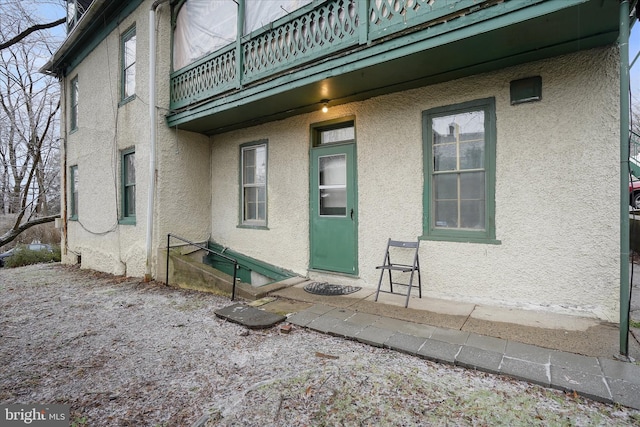 view of side of property with a balcony