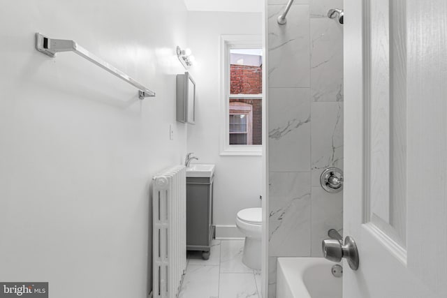 full bathroom with vanity, toilet, radiator heating unit, and tiled shower / bath