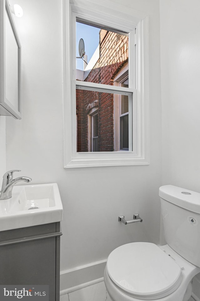 bathroom with vanity and toilet