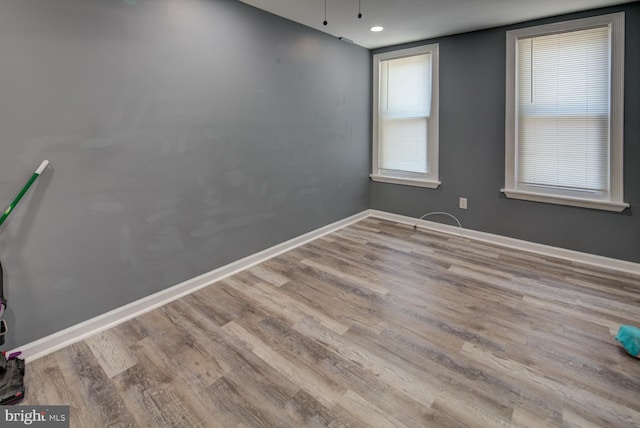 spare room with light wood-type flooring