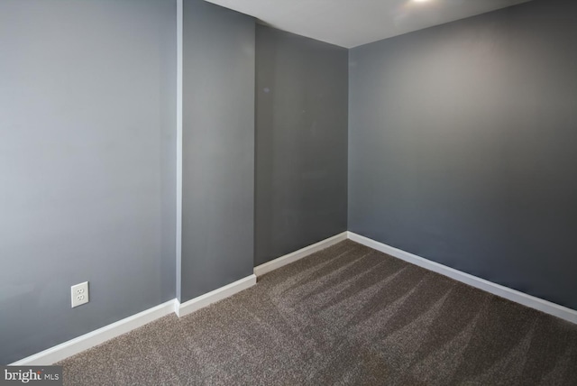 unfurnished room featuring carpet flooring