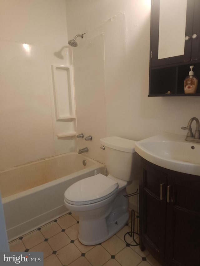 bathroom featuring vanity, bathing tub / shower combination, and toilet