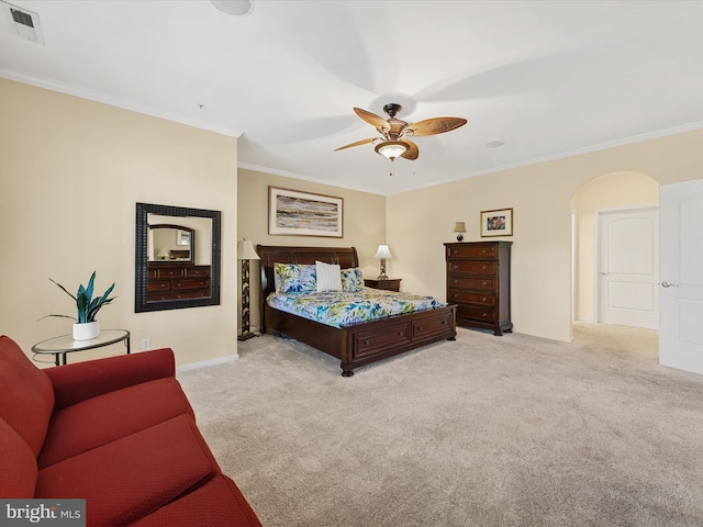 bedroom with ceiling fan, light colored carpet, and ornamental molding