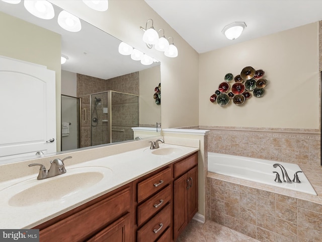 bathroom with shower with separate bathtub, vanity, and tile patterned floors