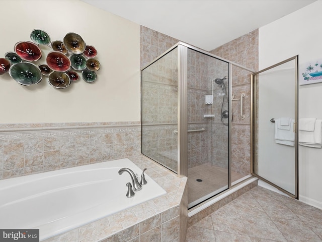 bathroom featuring tile patterned flooring and plus walk in shower