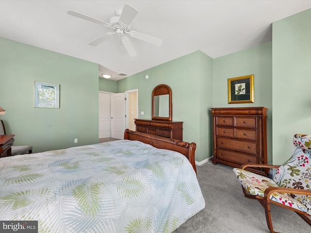 bedroom with light carpet, a closet, and ceiling fan