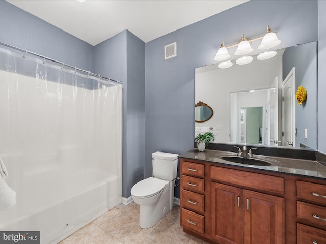 full bathroom with tile patterned floors, shower / tub combo with curtain, vanity, and toilet