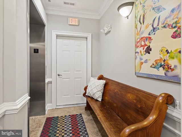 interior space with ornamental molding and light tile patterned floors