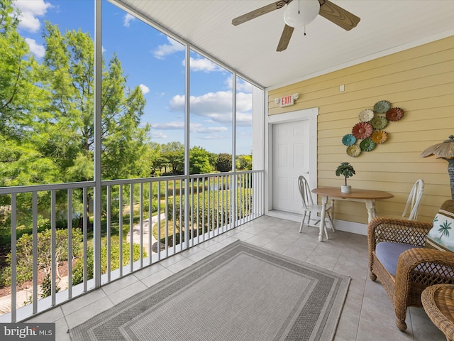 sunroom with plenty of natural light and ceiling fan